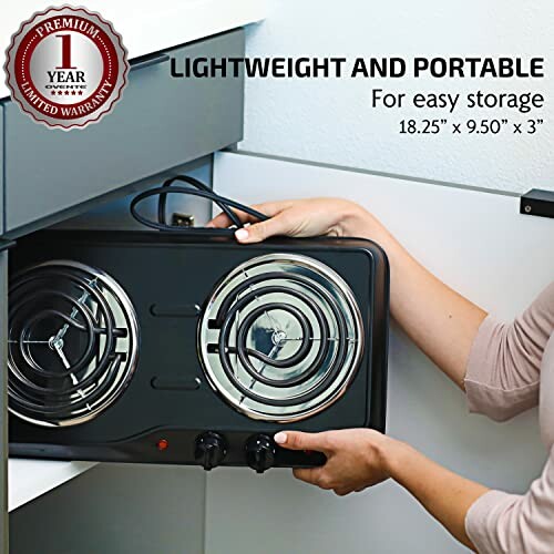 Person storing a lightweight portable electric stovetop in a drawer.