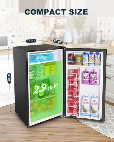 Compact mini fridge with open door showing interior storage space and dimensions.