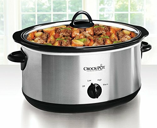 Slow cooker filled with stew in a kitchen setting.