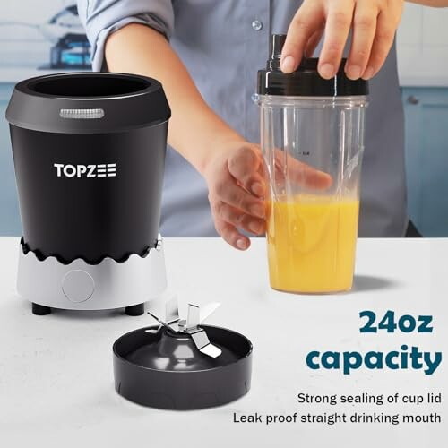 Person using a Topzee blender with a 24oz capacity container.