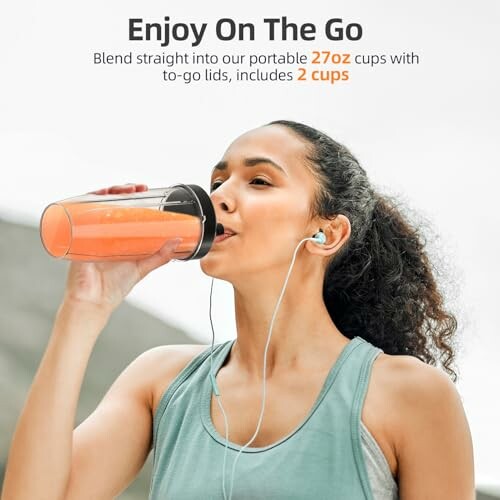 Woman drinking smoothie from a portable cup while wearing headphones.